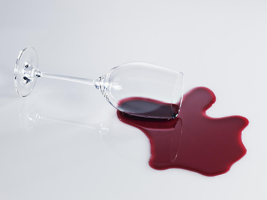 Red wine spilling from glass Photograph by Robert Daly