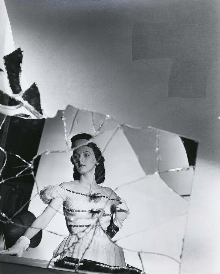 Reflection In Broken Mirror Of Model Wearing Photograph by Horst P. Horst