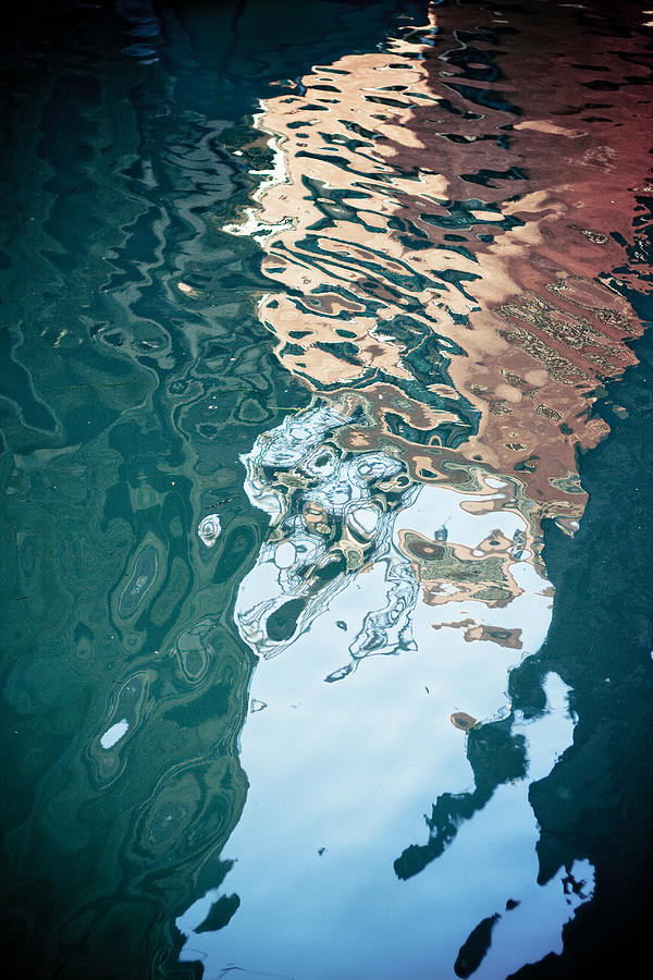 Reflection in Grand canal by Rialto Bridge in Venice Italy Photograph by Raimond Klavins