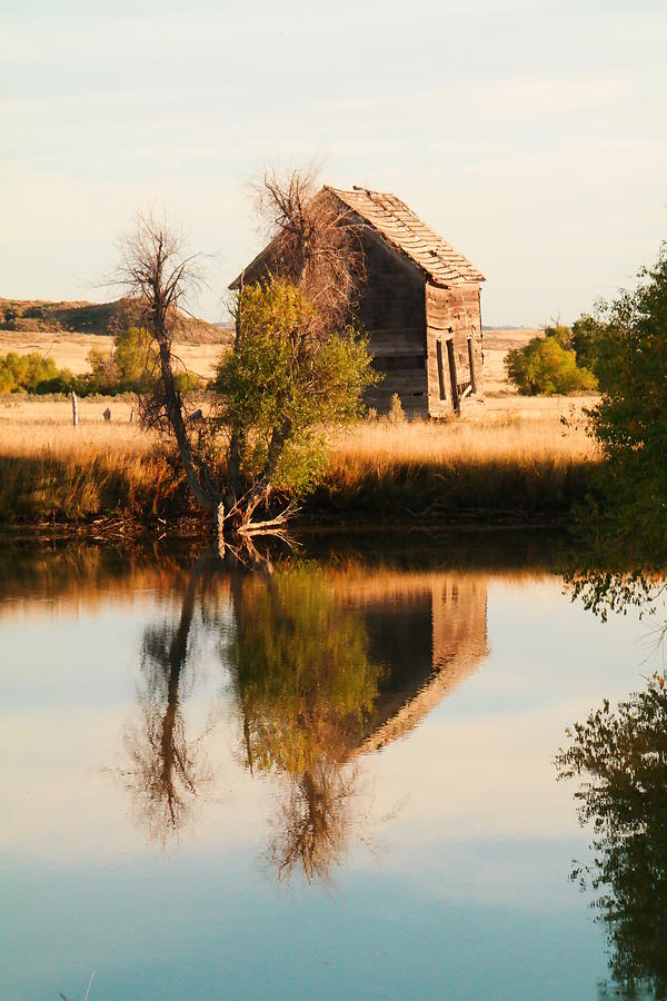Reflection of an old barn  Photograph by Jeff Swan