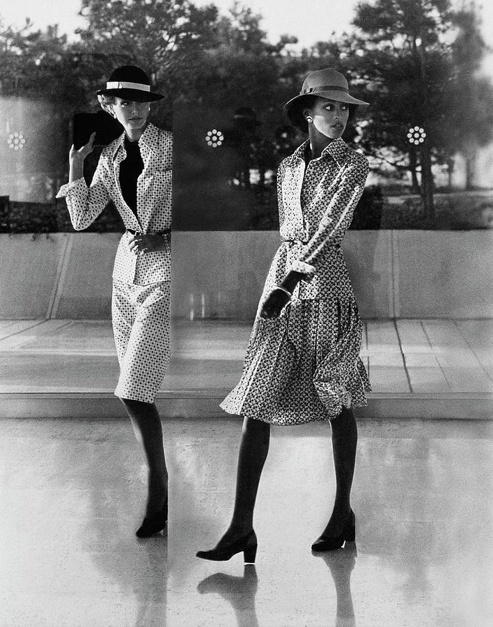 Reflection Of Models Wearing Patterned Skirts Photograph by Kourken Pakchanian
