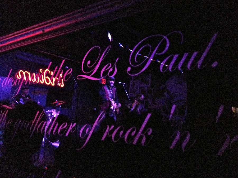 Reflection of Otis Taylor in the Les Paul sign at the Iridium  Photograph by Anna Ruzsan