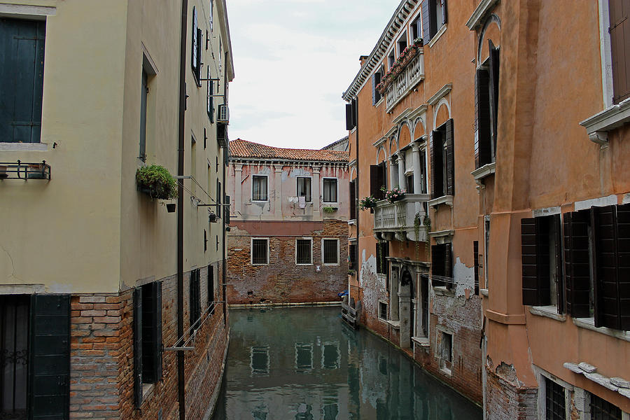 Reflections in Venetian Canal Photograph by Tony Murtagh