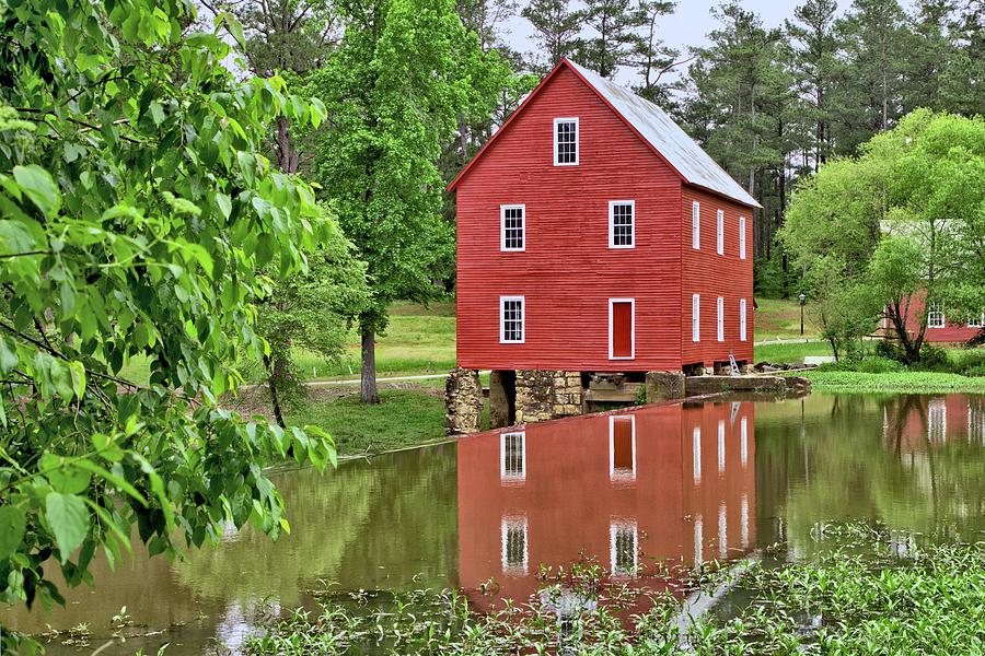 Reflections of a Retired Grist Mill Photograph by Gordon Elwell