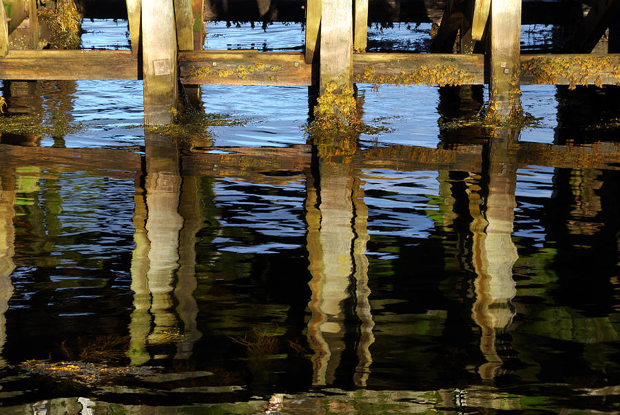 Reflections On A Jetty Photograph by Wendy Wilton