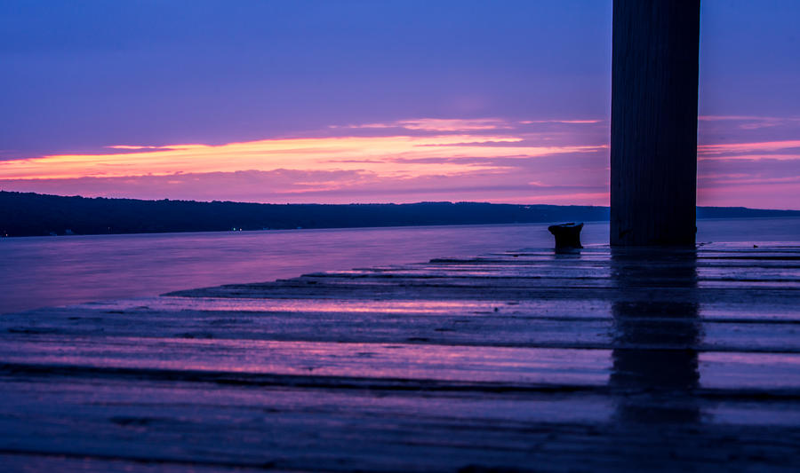 Sunset Photograph - Reflections on a rain soaked dock - Seneca Lake - New York by Photographic Arts And Design Studio