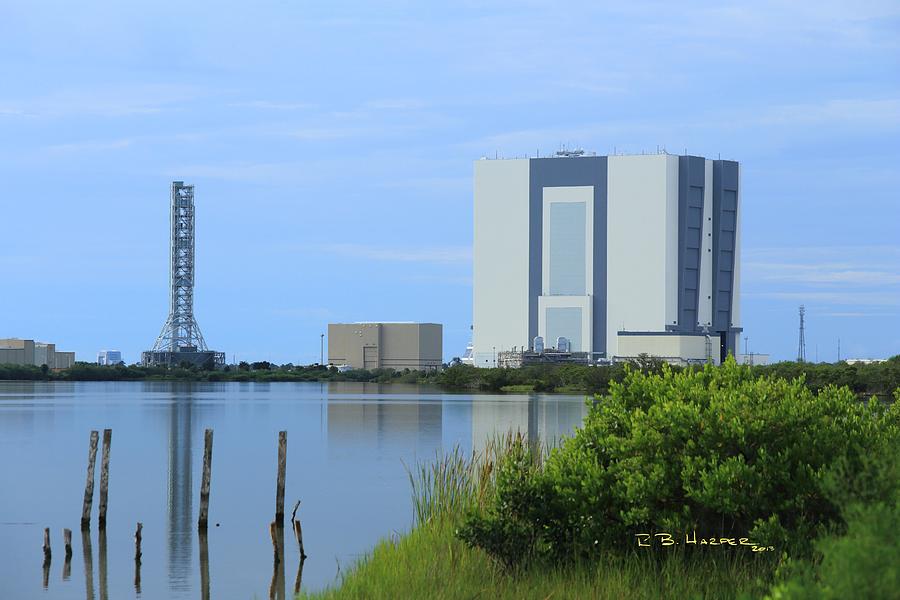 Reflections on the Vehicle Assembly Building Photograph by R B Harper