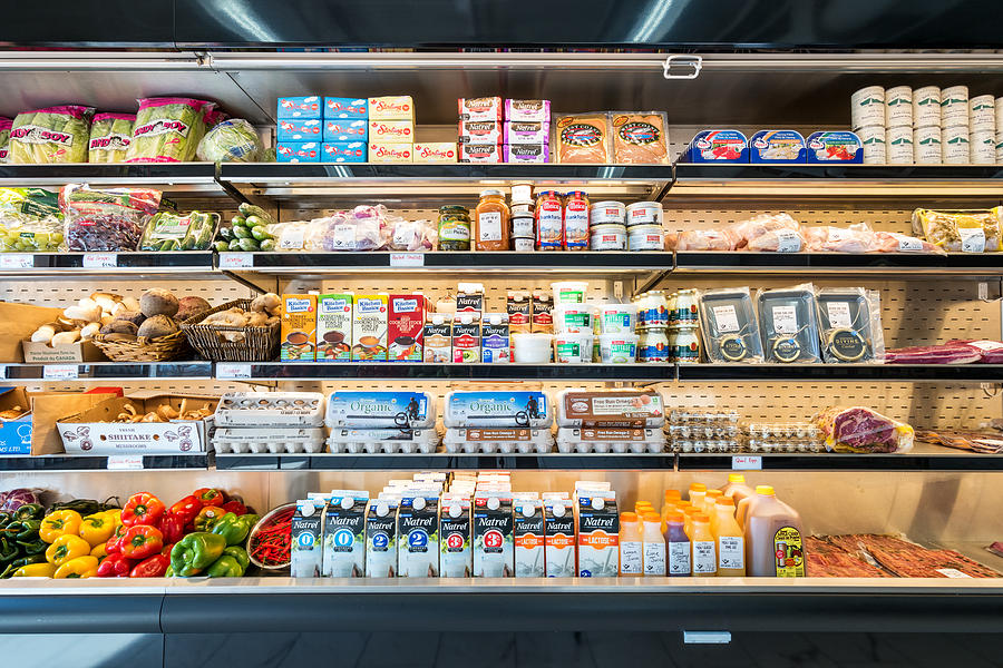 Refrigerator shelves in a grocery delicatessen store Photograph by Benedek