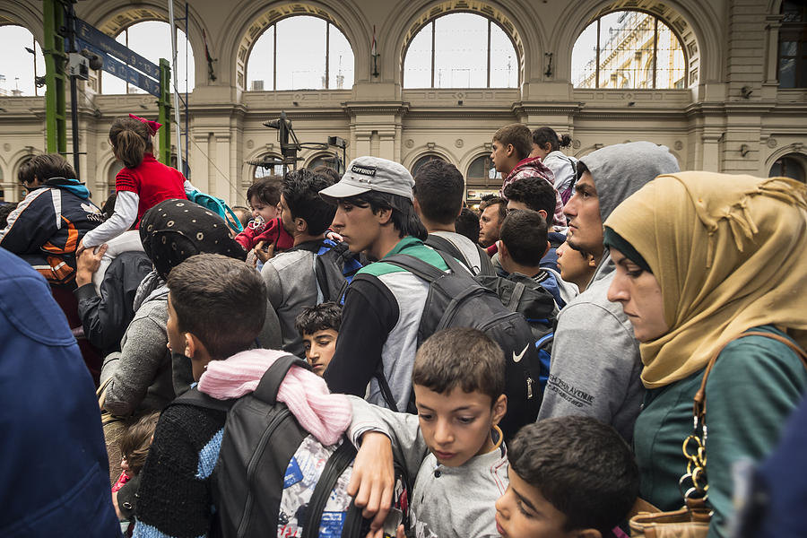 Refugees in train station Photograph by Fstoplight