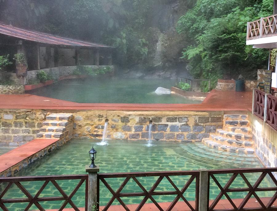 Hot Springs Photograph - A soak in the clouds by Josias Tomas