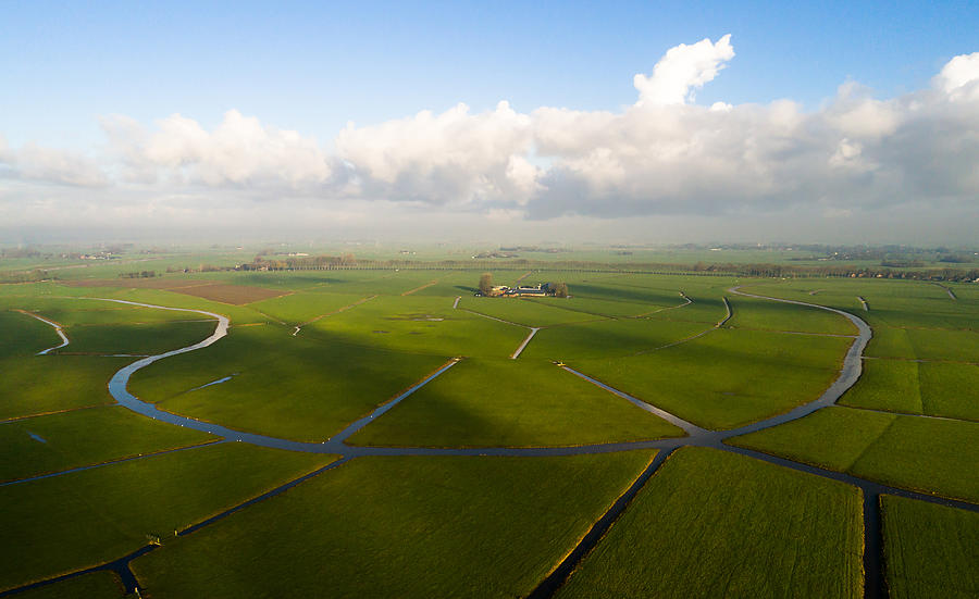 Remnants of a bending river in cultivated Dutch landscape, seen from the air Photograph by Daniel Bosma