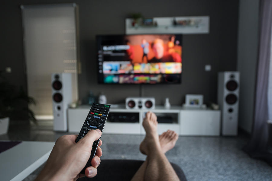 Remote Control with Television in living room Photograph by Dennis Fischer Photography