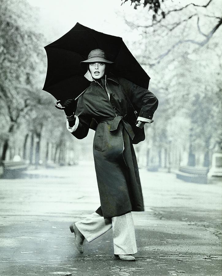Rene Russo Wearing A Coat And Trousers Photograph by Francesco Scavullo