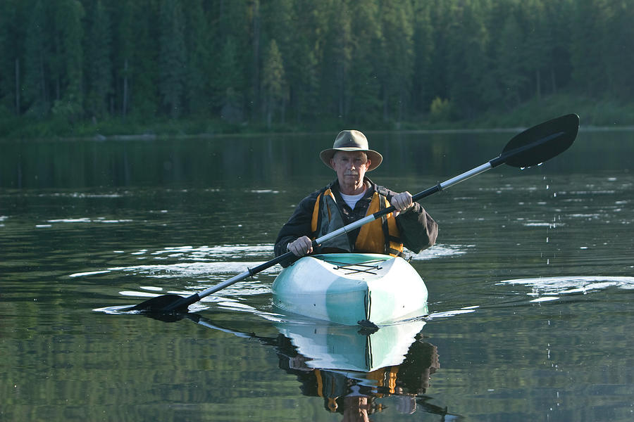 Sports Photograph - Retired Man Kayaking In Idaho by Patrick Orton