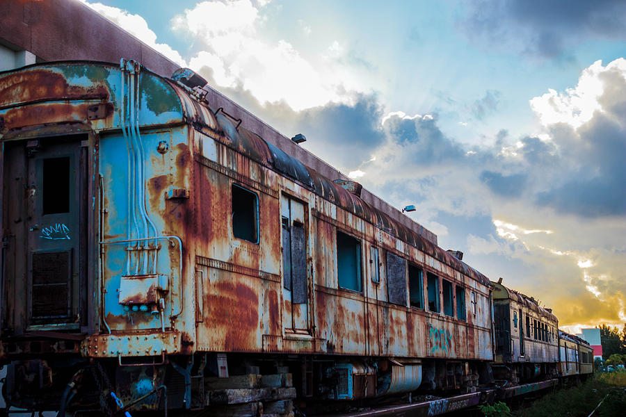 Retired Train cars Photograph by George Kenhan