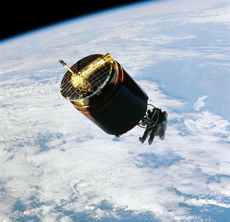 Retrieval Of Damaged Communications Satellite. Photograph by Nasa/science Photo Library.