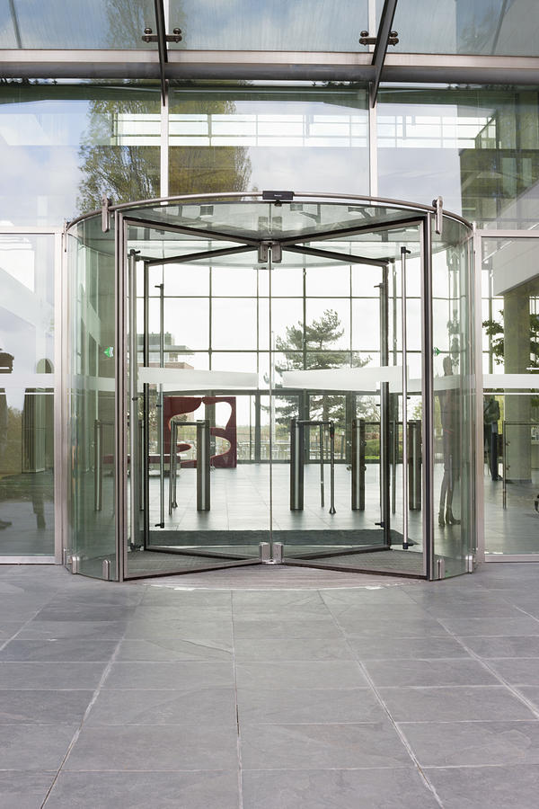 Revolving door of an office building Photograph by ONOKY - Fabrice LEROUGE