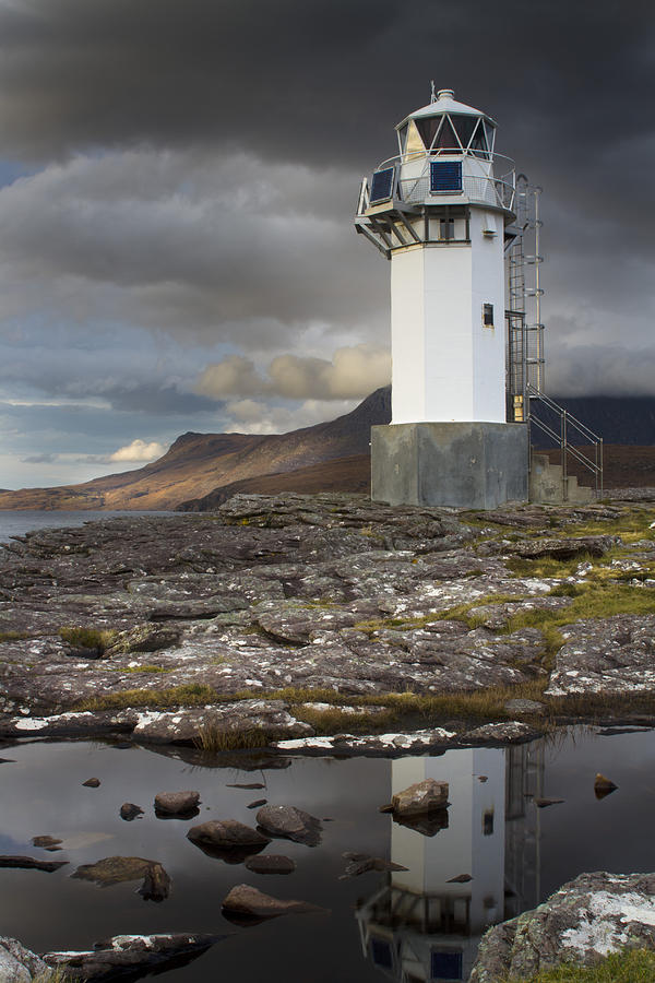 Lighthouse Photograph - Rhue Lighthouse reflected by Bob Falconer