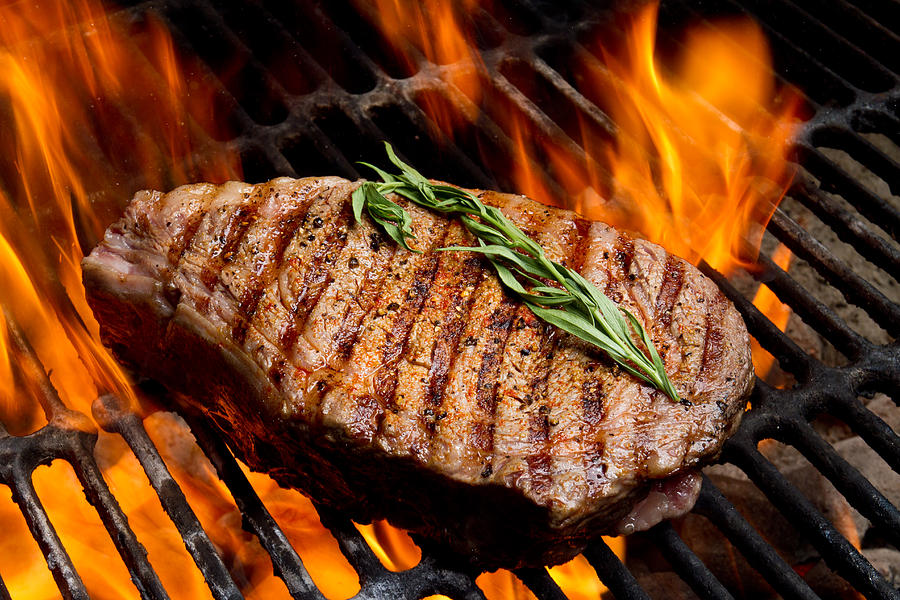 Ribeye Steak on Grill with Fire Photograph by Grandriver