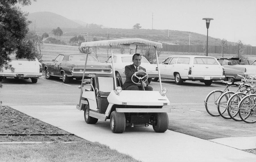 Richard Nixon Driving A Golf Cart Photograph by Everett Richard Nixon Driving A Golf Cart Photograph by Everett