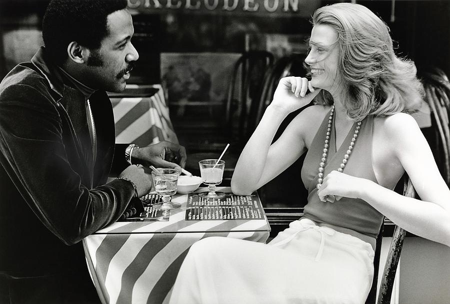 Richard Roundtree And Model At Cafe Photograph by Rico Puhlmann