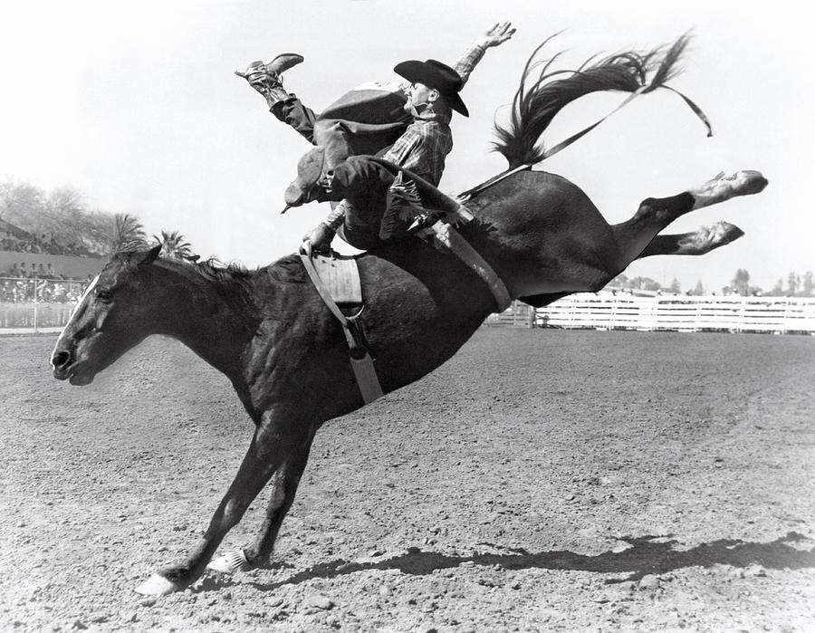 Kansas City Photograph - Riding A Bucking Bronco by Underwood Archives