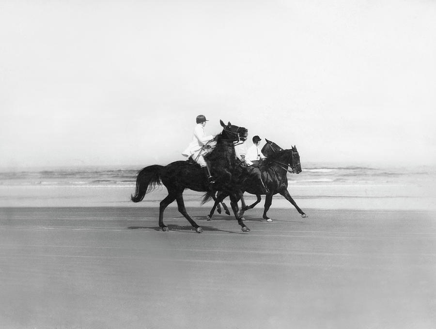 Riding Horses On The Beach Photograph by Underwood Archives  RH LeSesne
