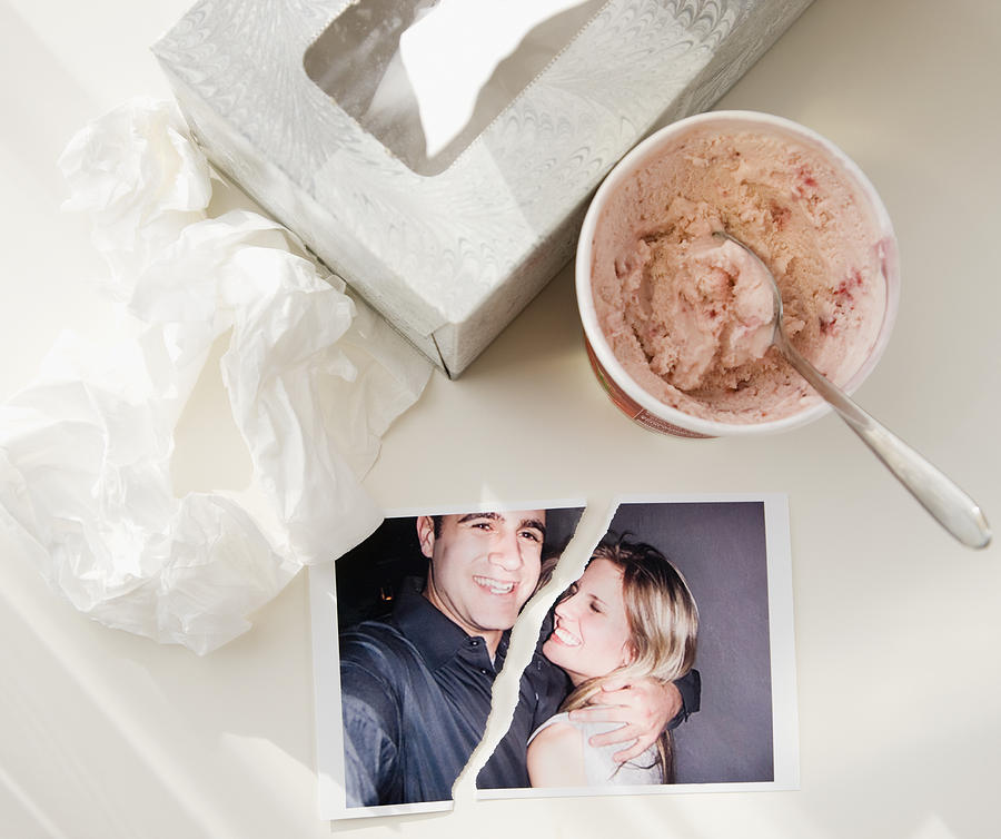 Ripped photograph next to ice cream and tissues Photograph by Jamie Grill