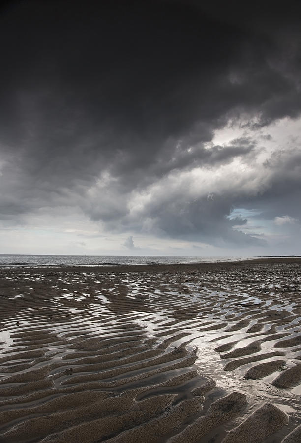 Beach Photograph - Rippled Sand Under A Dark Cloud At The by John Short