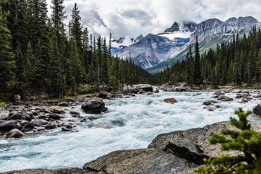 River rapids flowing near mountain Photograph by Steve Smith
