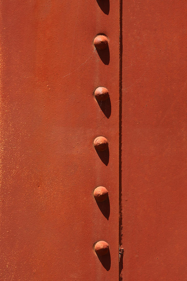 Rivets in Orange Photograph by Art Block Collections