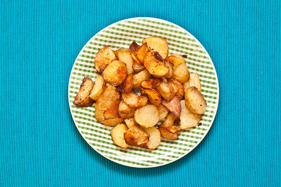 Potato Photograph - Roast potatoes by Tom Gowanlock