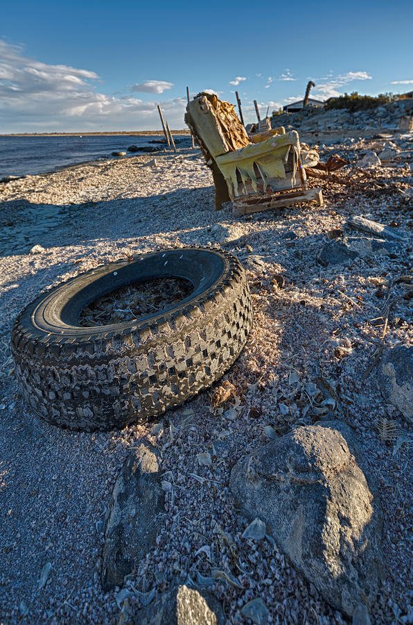 Rock bounces off tire rock breaks chair Photograph by Scott Campbell