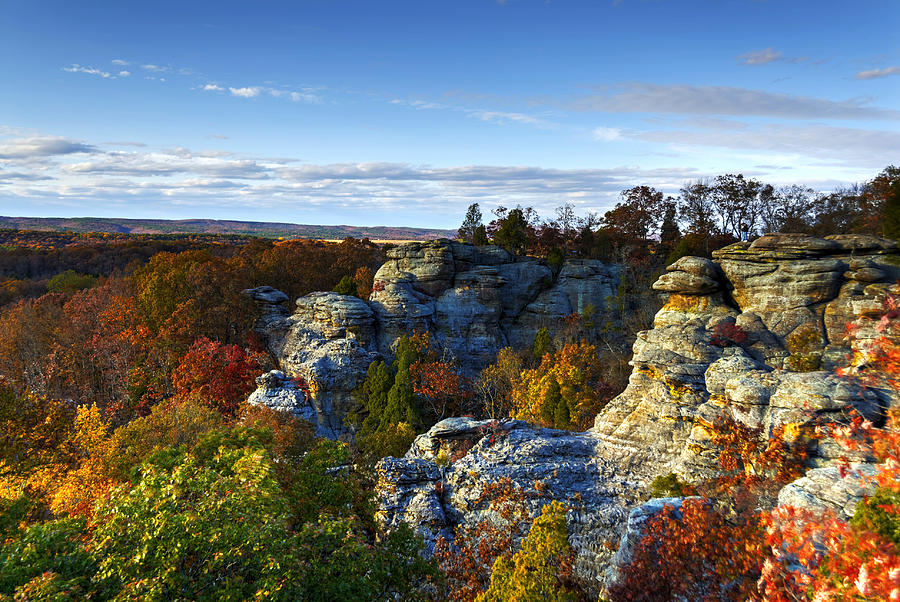 Rock formations surrounded by trees with autumnal foliage on sunny day, Illinois, USA Photograph by Daniel Ripplinger / DansPhotoArt