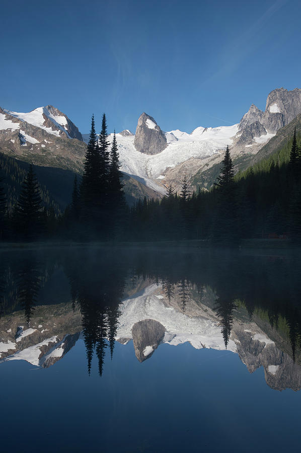 Rock Spires And Glaciers Reflected In Photograph by Topher Donahue