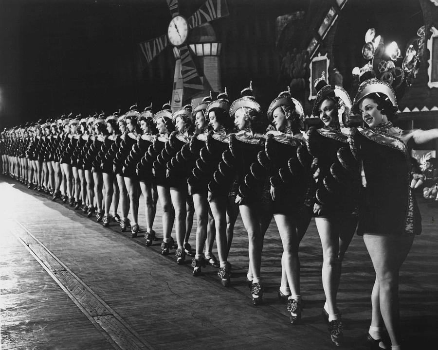 Vintage Photograph - Rockettes Brighten Up Manhattan Streets by Retro Images Archive