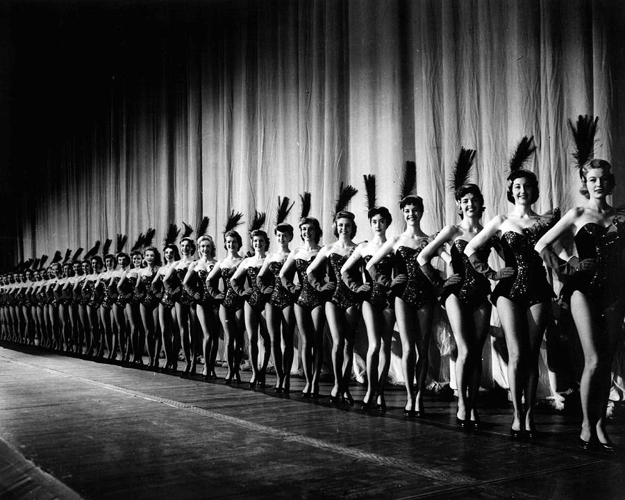 Rockettes In Tight Line In Front Of Curtain Photograph by Retro Images ...
