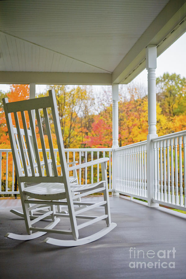 Rocking chairs on a porch in Autumn Photograph by Diane Diederich