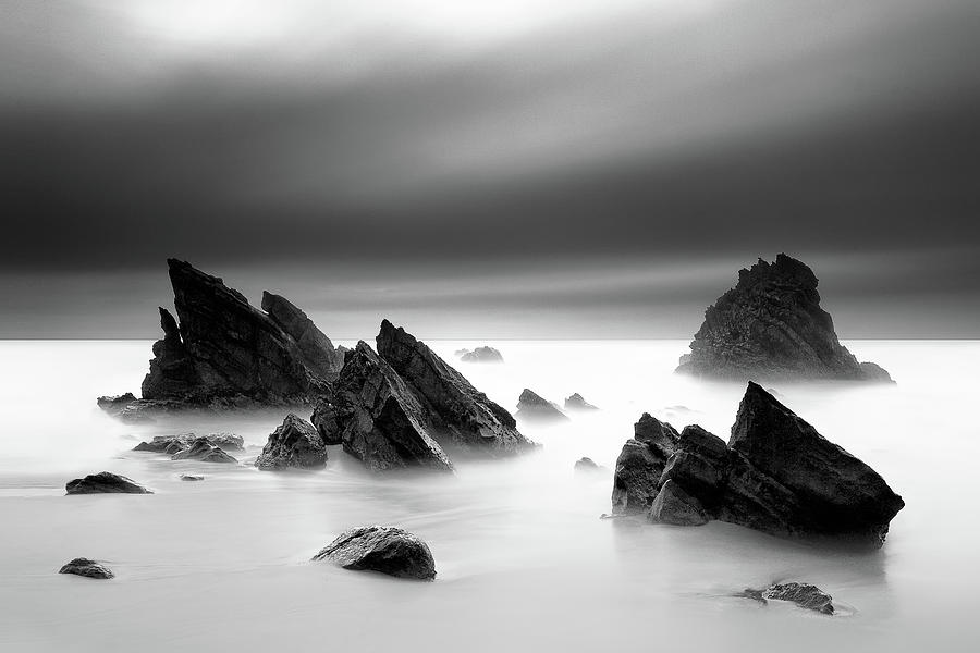Rocks In Sea Photograph by Cresende