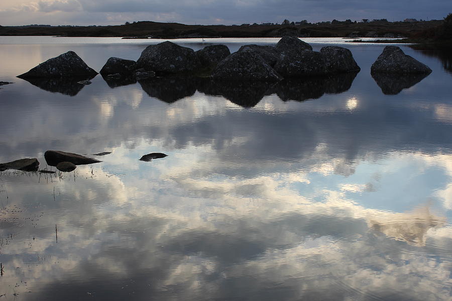 Rocks reflecting in water Photograph by Toni and Rene Maggio
