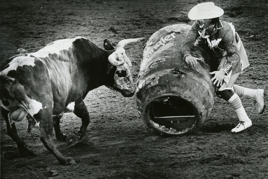 Rodeo Bull and Clown Fight Photograph by Retro Images Archive