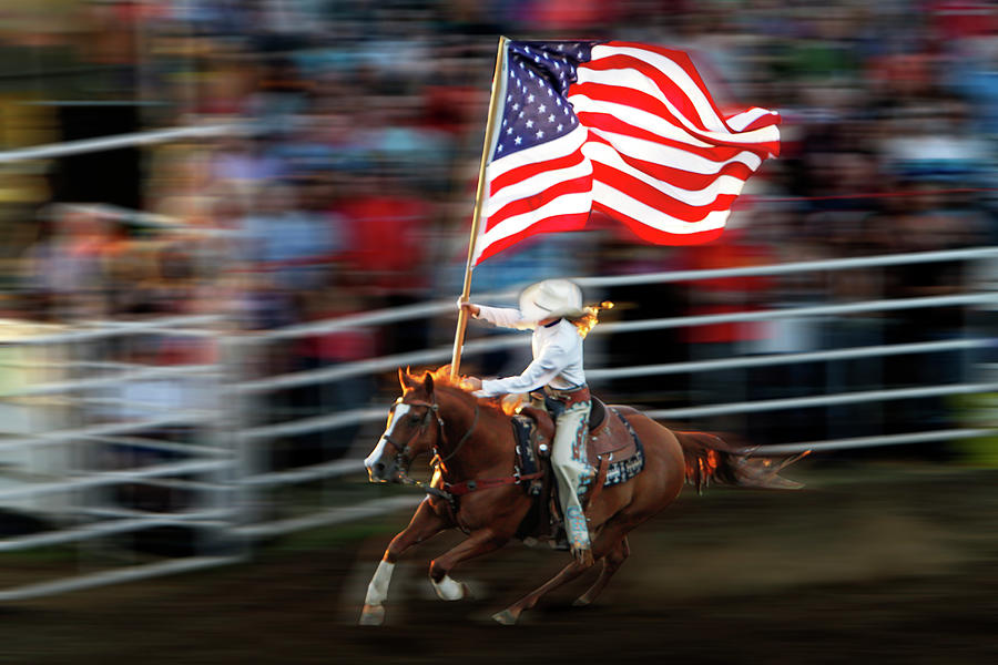 Rodeo Queen With American Flag Photograph by Bob Pool