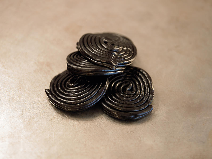 Rolls of liquorice Photograph by Image Source