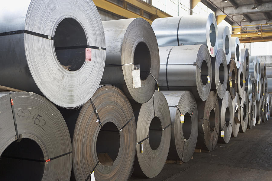 Rolls of steel in warehouse Photograph by Fotog