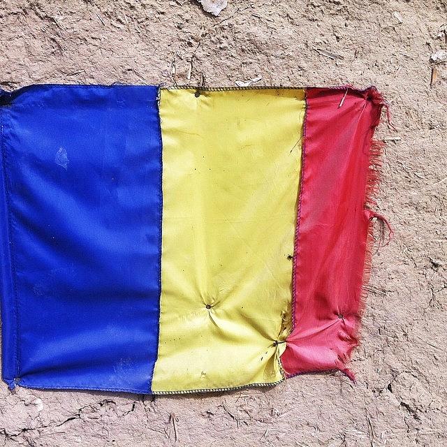 Flag Photograph - Romanian National Flag On A Wall by Adriano La Naia