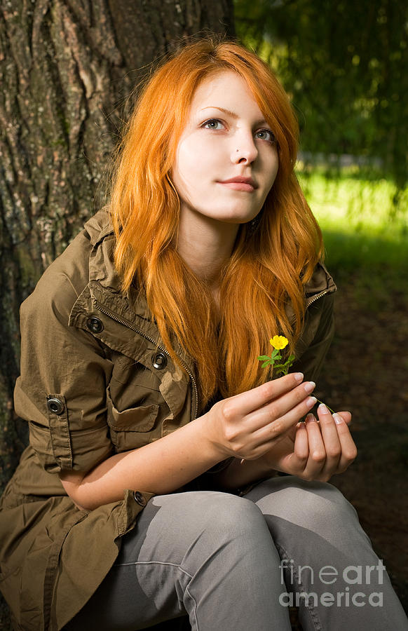 Romantic Portrait Of A Young Redhead Girl Sitting In The Park 3606