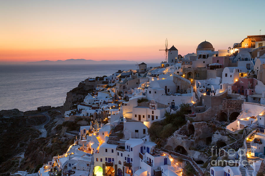 Romantic sunset over the village of Oia Greece Santorini Photograph by Matteo Colombo