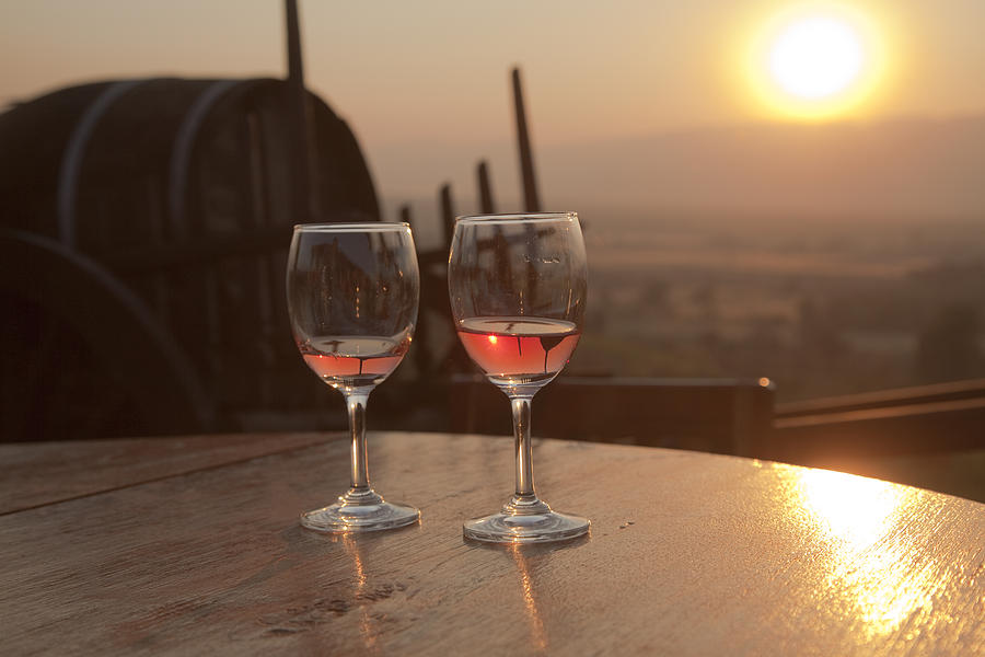 Romantic sunset with a glass of wine Photograph by Maria Heyens