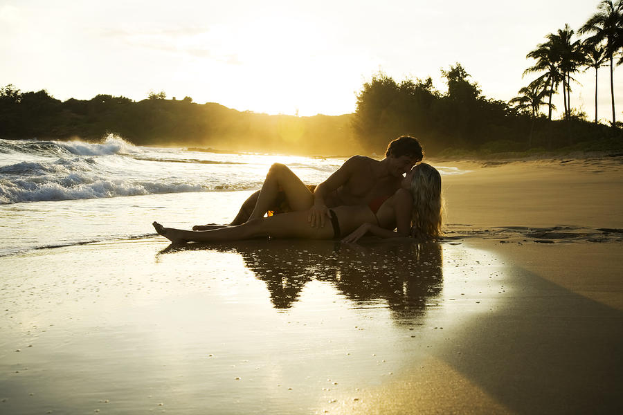 Romantic Young Couple at Sunset Photograph by Jhorrocks