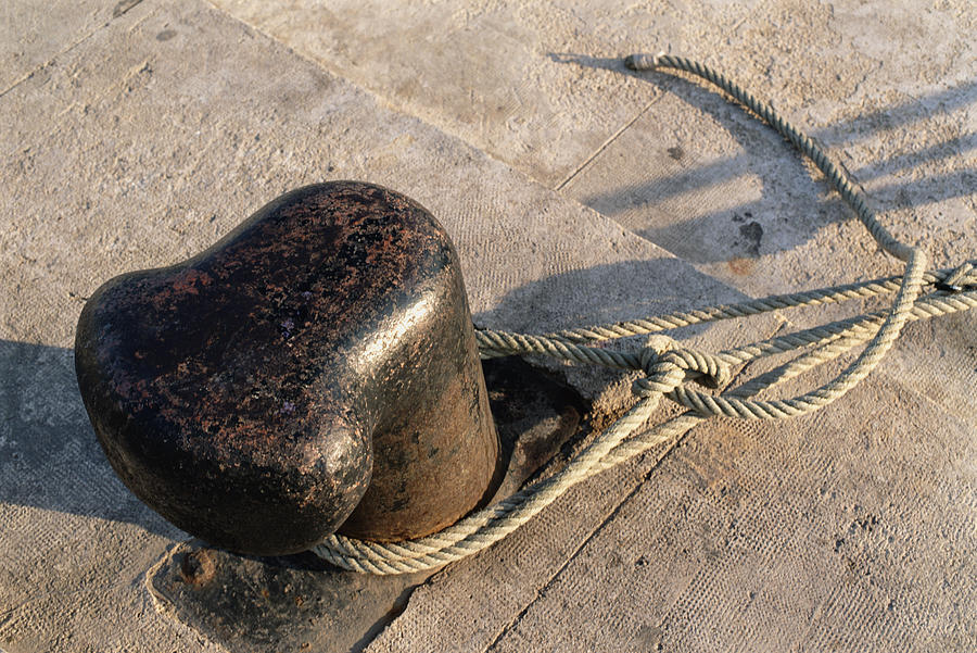 Rope tied around bollard, close-up Photograph by Sami Sarkis